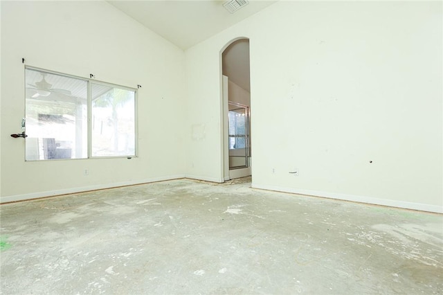 19385 Live Oak Ln, Lake Elsinore, CA 92530 - empty room featuring arched walkways, plenty of natural light, concrete flooring, and lofted ceiling