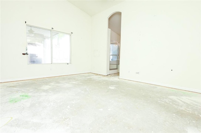 19385 Live Oak Ln, Lake Elsinore, CA 92530 - unfurnished room featuring arched walkways, unfinished concrete floors, and lofted ceiling