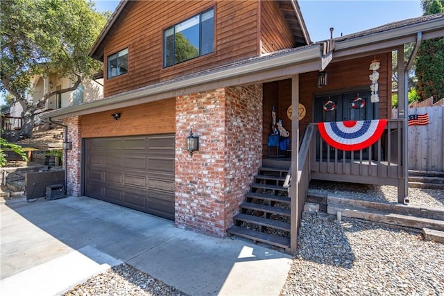 952 Margarita Ave, Grover Beach, CA 93433 - view of front of property featuring an attached garage, driveway, brick siding, and covered porch