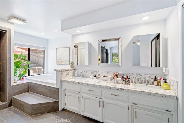 952 Margarita Ave, Grover Beach, CA 93433 - bathroom featuring double vanity, a garden tub, and tile patterned floors