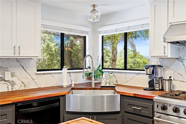 952 Margarita Ave, Grover Beach, CA 93433 - kitchen with wooden counters, dishwasher, tasteful backsplash, and white cabinetry