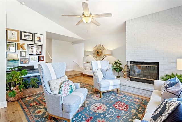 952 Margarita Ave, Grover Beach, CA 93433 - living room with wood finished floors, lofted ceiling, a brick fireplace, and a ceiling fan
