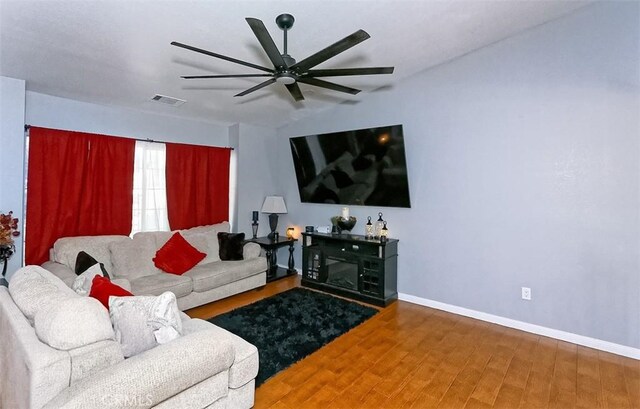13665 Hidden Valley Rd, Victorville, CA 92395 - living room with ceiling fan and wood finished floors