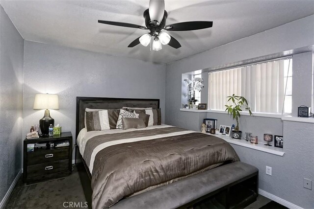 13665 Hidden Valley Rd, Victorville, CA 92395 - bedroom featuring baseboards and a ceiling fan