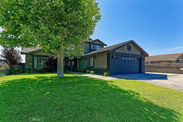 13665 Hidden Valley Rd, Victorville, CA 92395 - view of front of house with an attached garage, concrete driveway, and stucco siding
