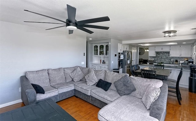 13665 Hidden Valley Rd, Victorville, CA 92395 - living area featuring wood finished floors and ceiling fan