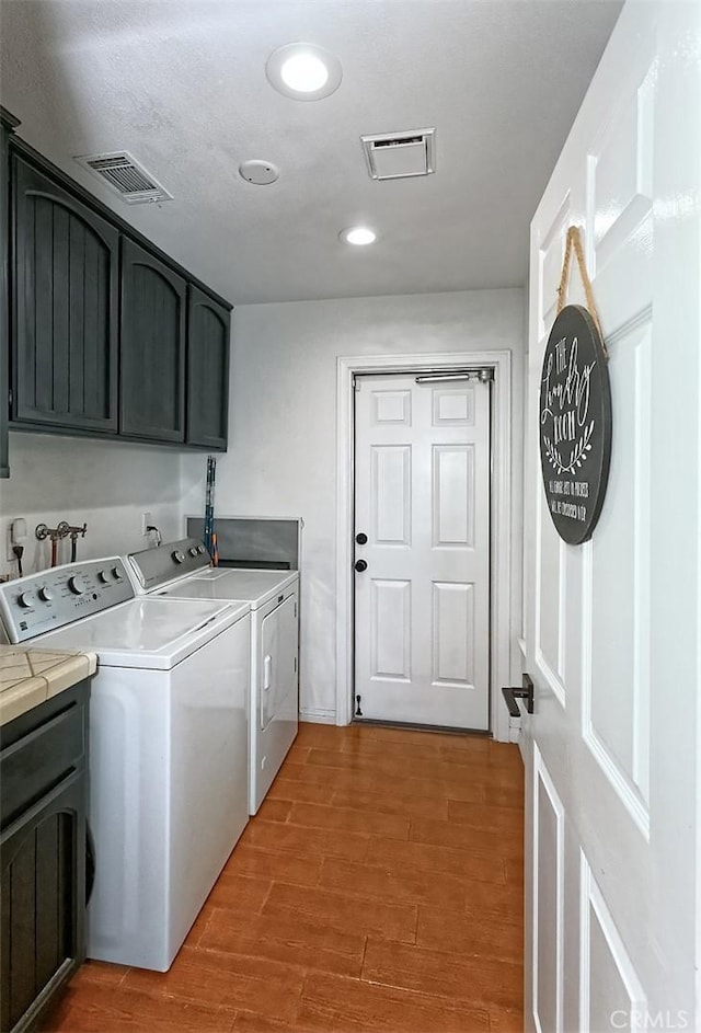 13665 Hidden Valley Rd, Victorville, CA 92395 - washroom with cabinet space, washing machine and clothes dryer, light wood-style floors, and recessed lighting
