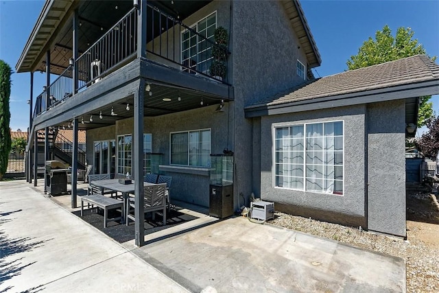 13665 Hidden Valley Rd, Victorville, CA 92395 - view of patio featuring outdoor dining area, a grill, and stairs