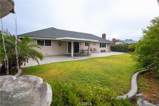 9025 La Vine St, Rancho Cucamonga, CA 91701 - back of property featuring a patio area, a yard, stucco siding, and a chimney