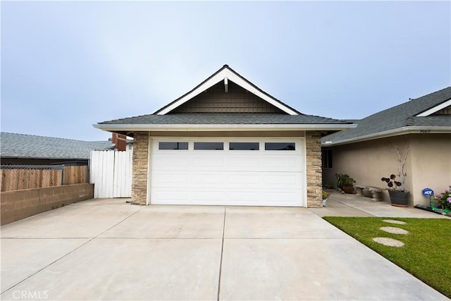 9025 La Vine St, Rancho Cucamonga, CA 91701 - view of front of property with stone siding, concrete driveway, a garage, and a shingled roof