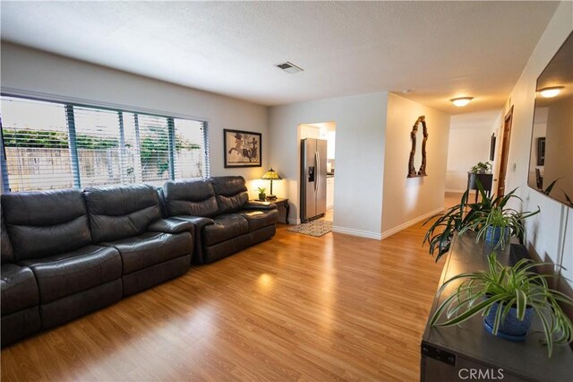 9025 La Vine St, Rancho Cucamonga, CA 91701 - living room with light wood finished floors and baseboards