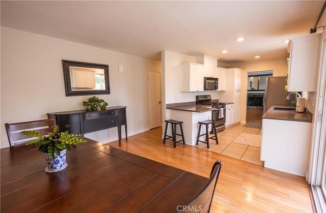 9025 La Vine St, Rancho Cucamonga, CA 91701 - dining space with light wood-style flooring and recessed lighting
