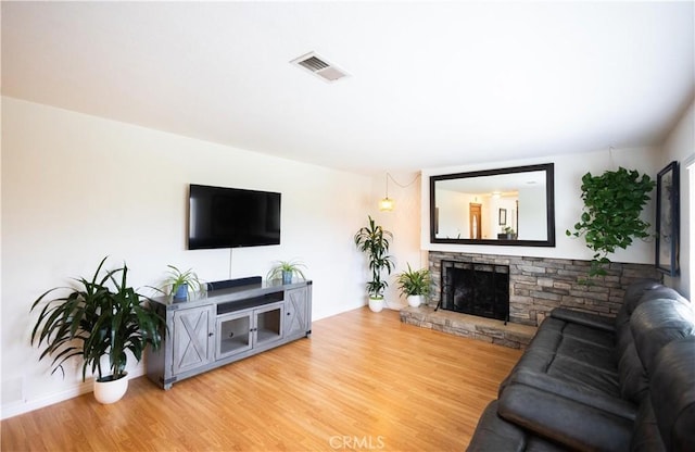9025 La Vine St, Rancho Cucamonga, CA 91701 - living area with wood finished floors and a stone fireplace