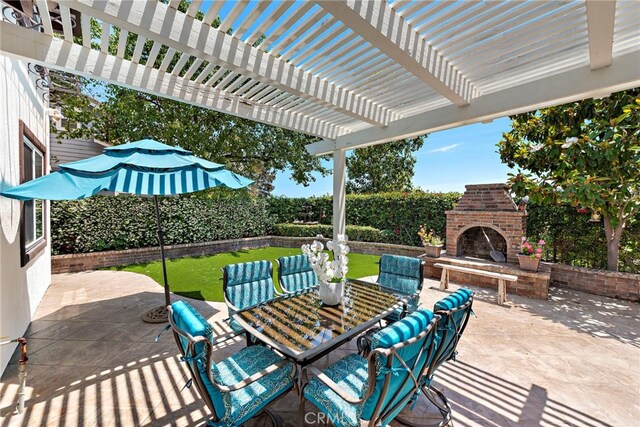 14 Downing St, Ladera Ranch, CA 92694 - fenced backyard featuring an outdoor brick fireplace, a patio, outdoor dining area, and a pergola