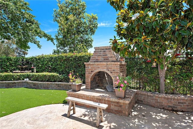 14 Downing St, Ladera Ranch, CA 92694 - view of patio featuring an outdoor brick fireplace