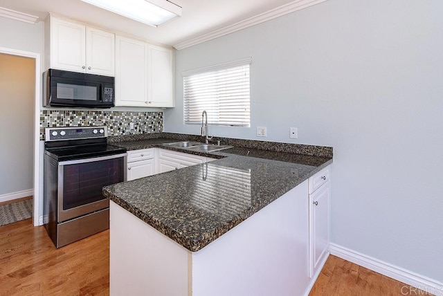 17159 W Bernardo Dr Unit 202, San Diego, CA 92127 - kitchen with black microwave, stainless steel electric range, a peninsula, white cabinetry, and light wood-type flooring