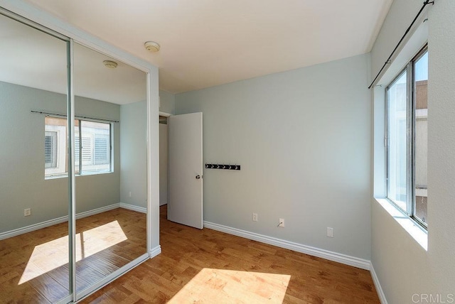 17159 W Bernardo Dr Unit 202, San Diego, CA 92127 - unfurnished bedroom featuring wood finished floors and a closet