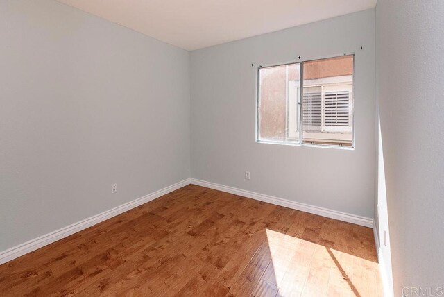 17159 W Bernardo Dr Unit 202, San Diego, CA 92127 - unfurnished room featuring wood finished floors and baseboards