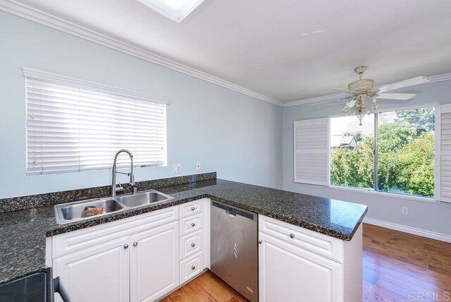 17159 W Bernardo Dr Unit 202, San Diego, CA 92127 - kitchen with stainless steel dishwasher, crown molding, white cabinets, a ceiling fan, and light wood finished floors