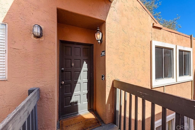 17159 W Bernardo Dr Unit 202, San Diego, CA 92127 - doorway to property featuring stucco siding