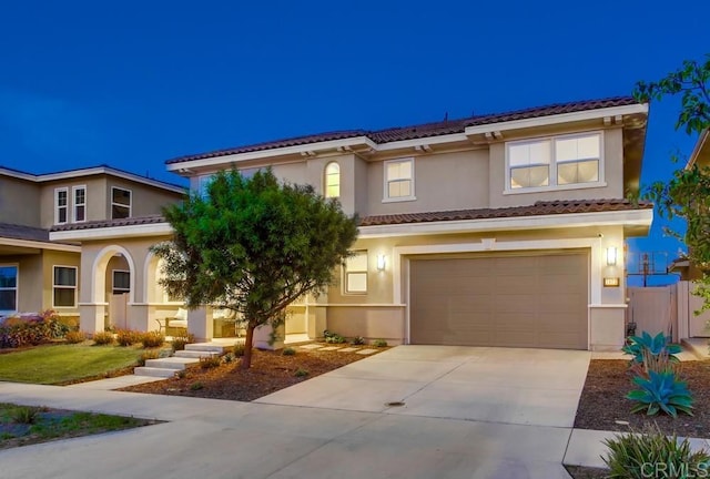 1873 El Paseo Ave, Chula Vista, CA 91913 - view of front facade featuring an attached garage, driveway, a tiled roof, and stucco siding