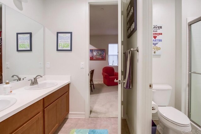 1873 El Paseo Ave, Chula Vista, CA 91913 - full bath featuring double vanity, a shower with shower door, and tile patterned flooring