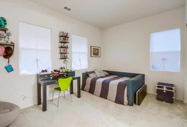 1873 El Paseo Ave, Chula Vista, CA 91913 - carpeted bedroom with multiple windows and a desk