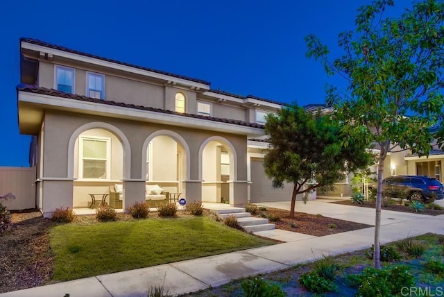 1873 El Paseo Ave, Chula Vista, CA 91913 - mediterranean / spanish-style house featuring concrete driveway, stucco siding, a front lawn, and covered porch