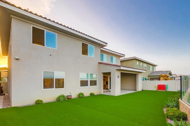 1873 El Paseo Ave, Chula Vista, CA 91913 - rear view of house with stucco siding, a tile roof, and a patio
