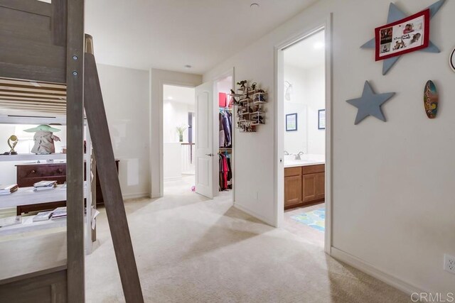 1873 El Paseo Ave, Chula Vista, CA 91913 - hallway featuring light colored carpet and a sink