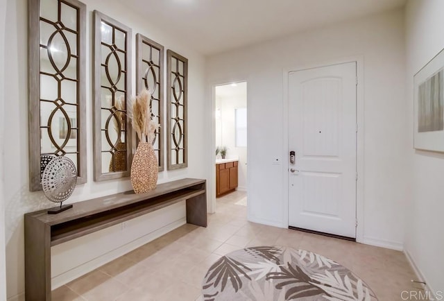 1873 El Paseo Ave, Chula Vista, CA 91913 - entrance foyer featuring light tile patterned floors and baseboards