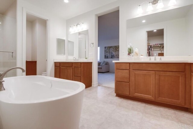 1873 El Paseo Ave, Chula Vista, CA 91913 - full bathroom with vanity, a freestanding bath, and recessed lighting