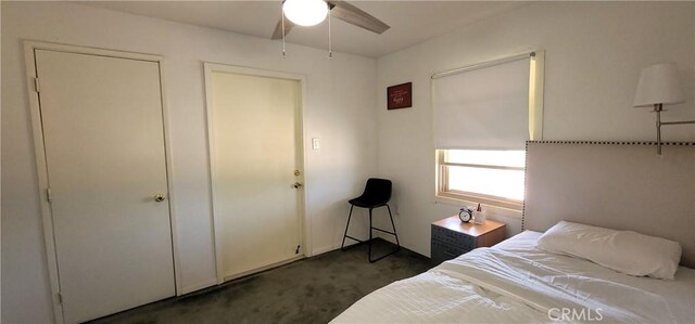12101 Kern Ave, Boron, CA 93516 - bedroom with dark carpet and a ceiling fan