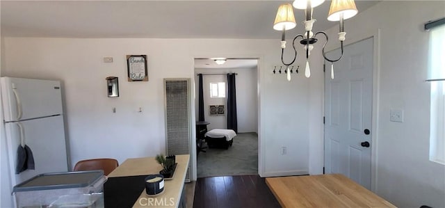 12101 Kern Ave, Boron, CA 93516 - dining room featuring a chandelier, dark wood-style floors, and a heating unit