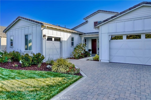 916 Trail View Pl, Nipomo, CA 93444 - view of front of home with board and batten siding and a garage