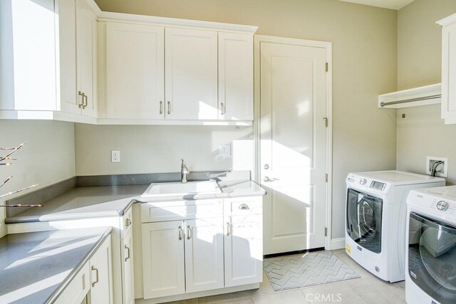 916 Trail View Pl, Nipomo, CA 93444 - washroom featuring cabinet space, washing machine and dryer, and light tile patterned floors