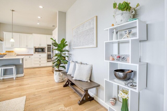 916 Trail View Pl, Nipomo, CA 93444 - kitchen featuring stainless steel appliances, light wood-style flooring, white cabinetry, hanging light fixtures, and recessed lighting