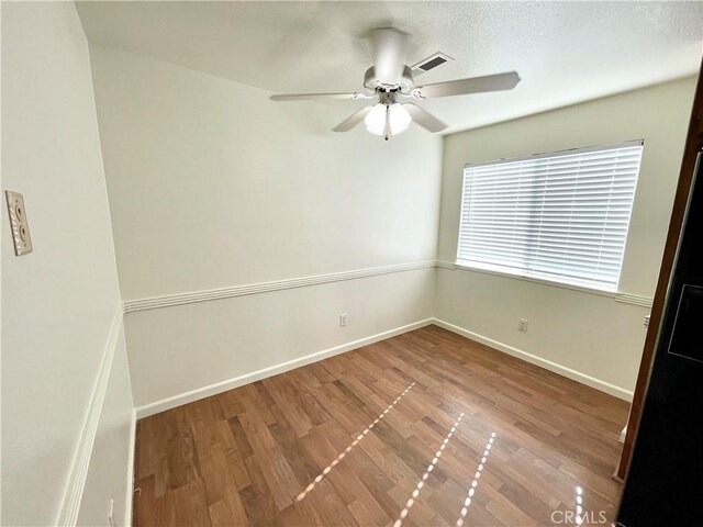 659 Royal Arch Ct, Merced, CA 95340 - spare room featuring wood finished floors and a ceiling fan