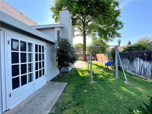 659 Royal Arch Ct, Merced, CA 95340 - fenced backyard with a playground