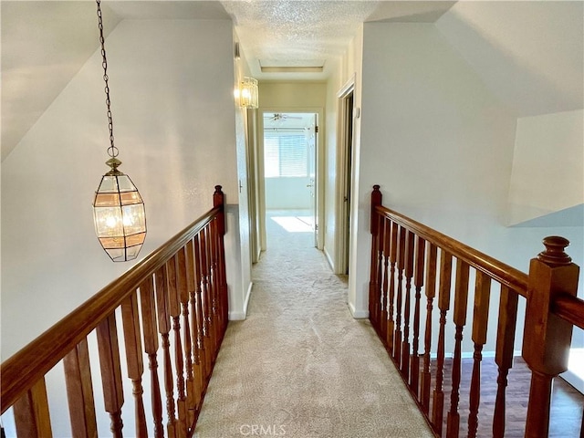 659 Royal Arch Ct, Merced, CA 95340 - hall featuring an upstairs landing, light carpet, and lofted ceiling