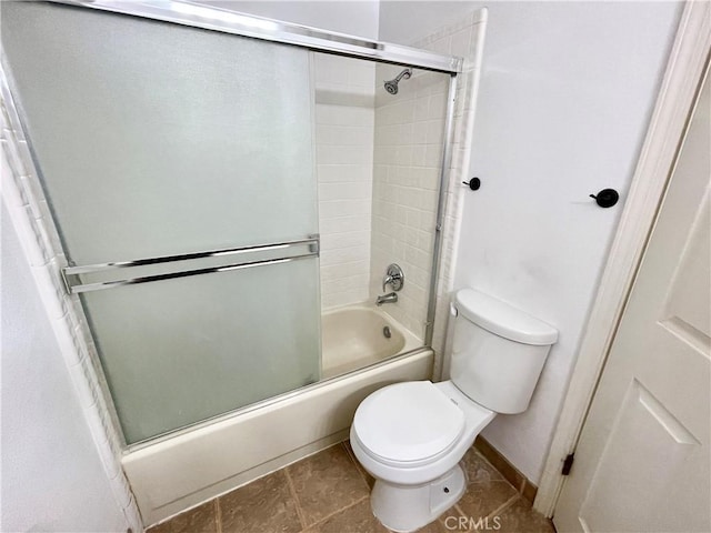 659 Royal Arch Ct, Merced, CA 95340 - bathroom with toilet and bath / shower combo with glass door