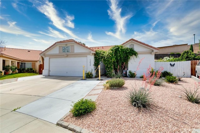 13035 Troy Ct, Victorville, CA 92395 - view of front of home featuring stucco siding, concrete driveway, a garage, and a tiled roof