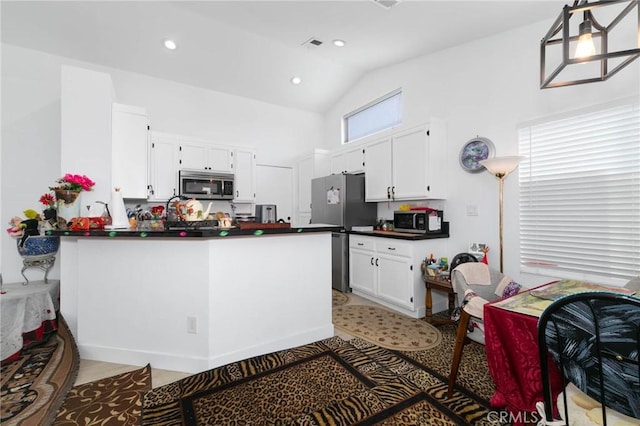 13035 Troy Ct, Victorville, CA 92395 - kitchen with stainless steel appliances, dark countertops, white cabinets, a peninsula, and high vaulted ceiling