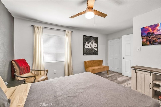 56565 Antelope Trl, Yucca Valley, CA 92284 - bedroom featuring light wood-style flooring and a ceiling fan