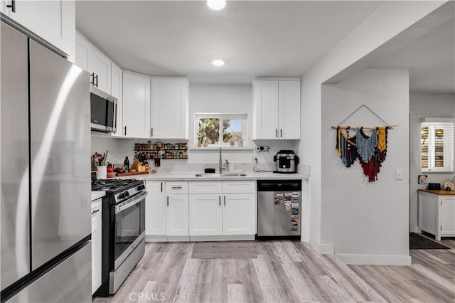 56565 Antelope Trl, Yucca Valley, CA 92284 - kitchen featuring appliances with stainless steel finishes, healthy amount of natural light, light wood finished floors, and recessed lighting