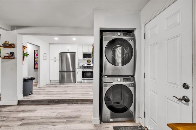 56565 Antelope Trl, Yucca Valley, CA 92284 - washroom with stacked washer / drying machine, light wood-type flooring, and recessed lighting