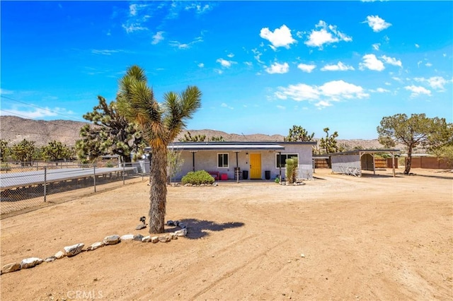 56565 Antelope Trl, Yucca Valley, CA 92284 - view of front facade featuring a mountain view and stucco siding