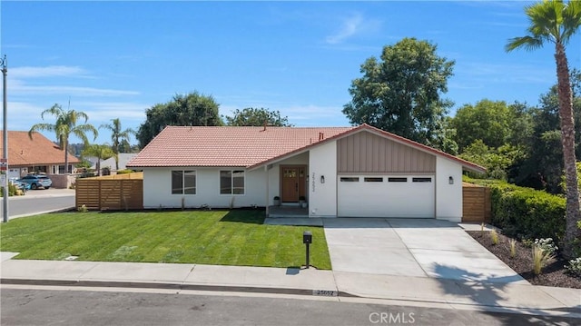 25652 Cervantes Ln, Mission Viejo, CA 92691 - view of front of house with an attached garage, a tiled roof, concrete driveway, and stucco siding