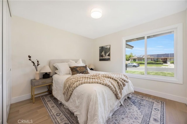 25652 Cervantes Ln, Mission Viejo, CA 92691 - bedroom with baseboards and light wood-style flooring