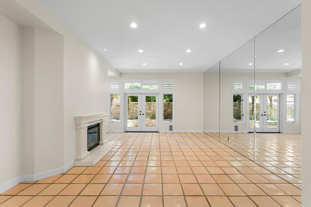 3647 Paseo Vista Famosa, Rancho Santa Fe, CA 92091 - unfurnished living room with french doors, healthy amount of natural light, light tile patterned floors, and recessed lighting